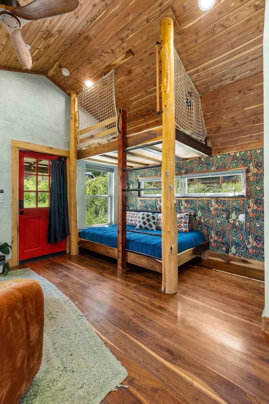 Blackbird built-in queen bunk bed beside the living area