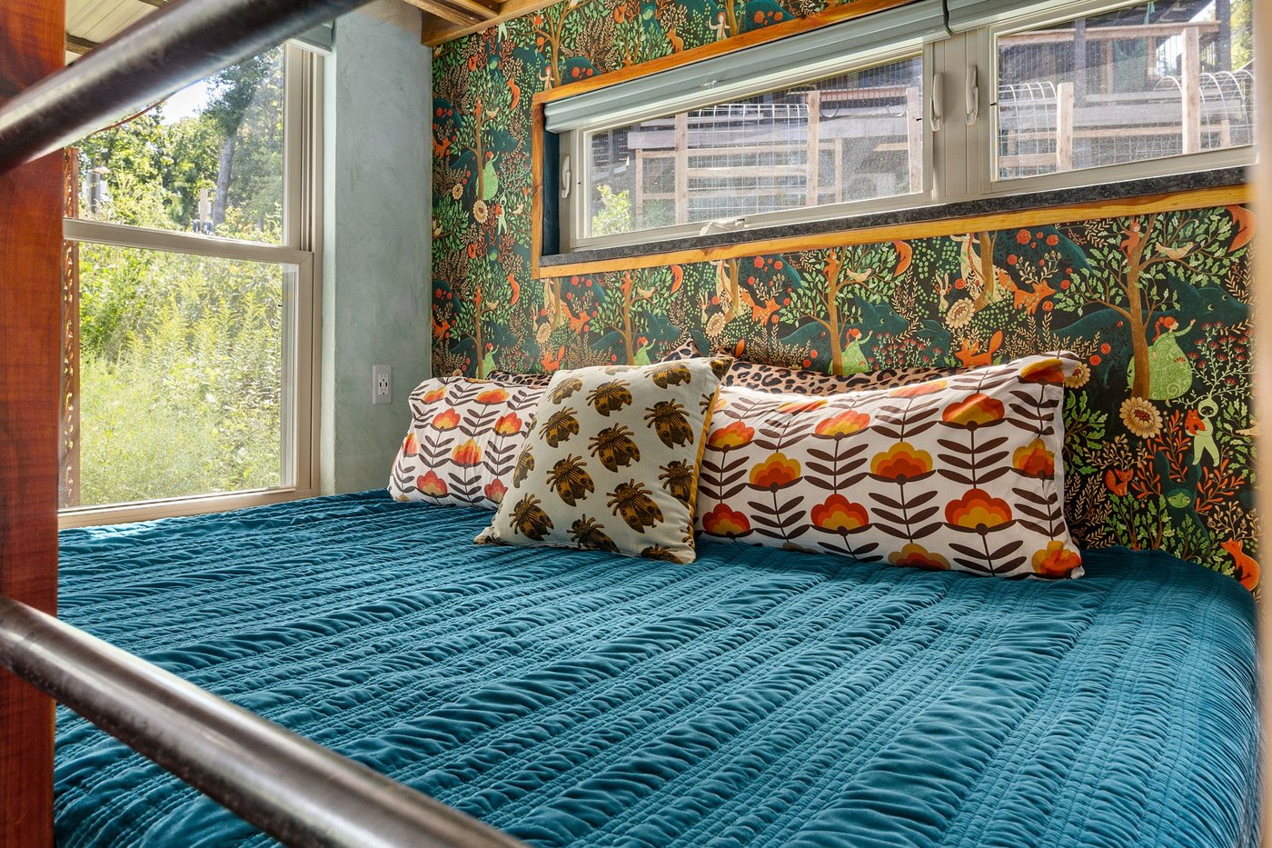 Blackbird daybed with botanical wallpaper and forest views