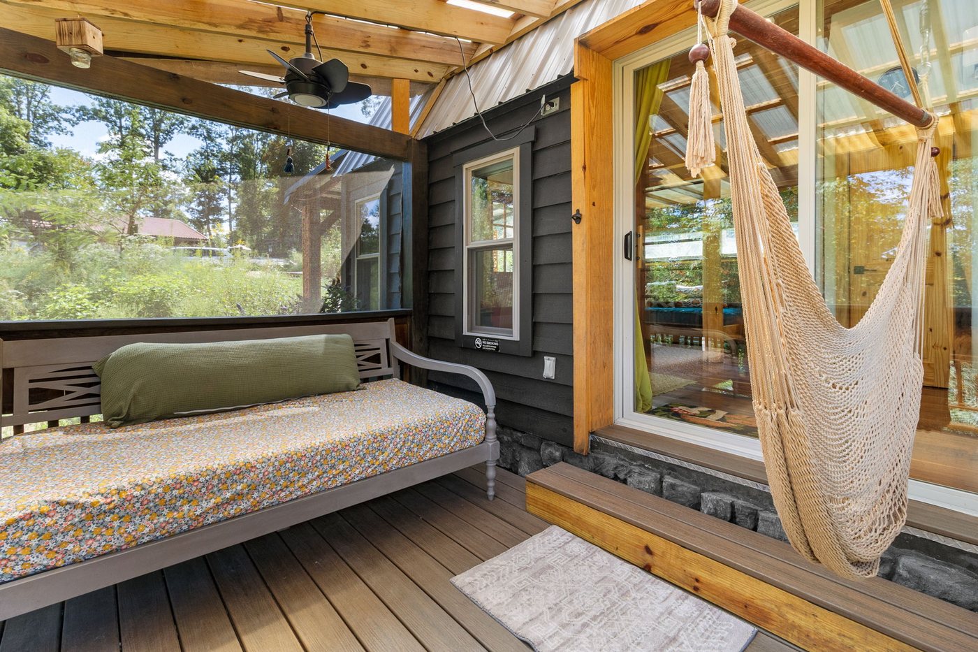 Blackbird open living room looking out to the screened porch