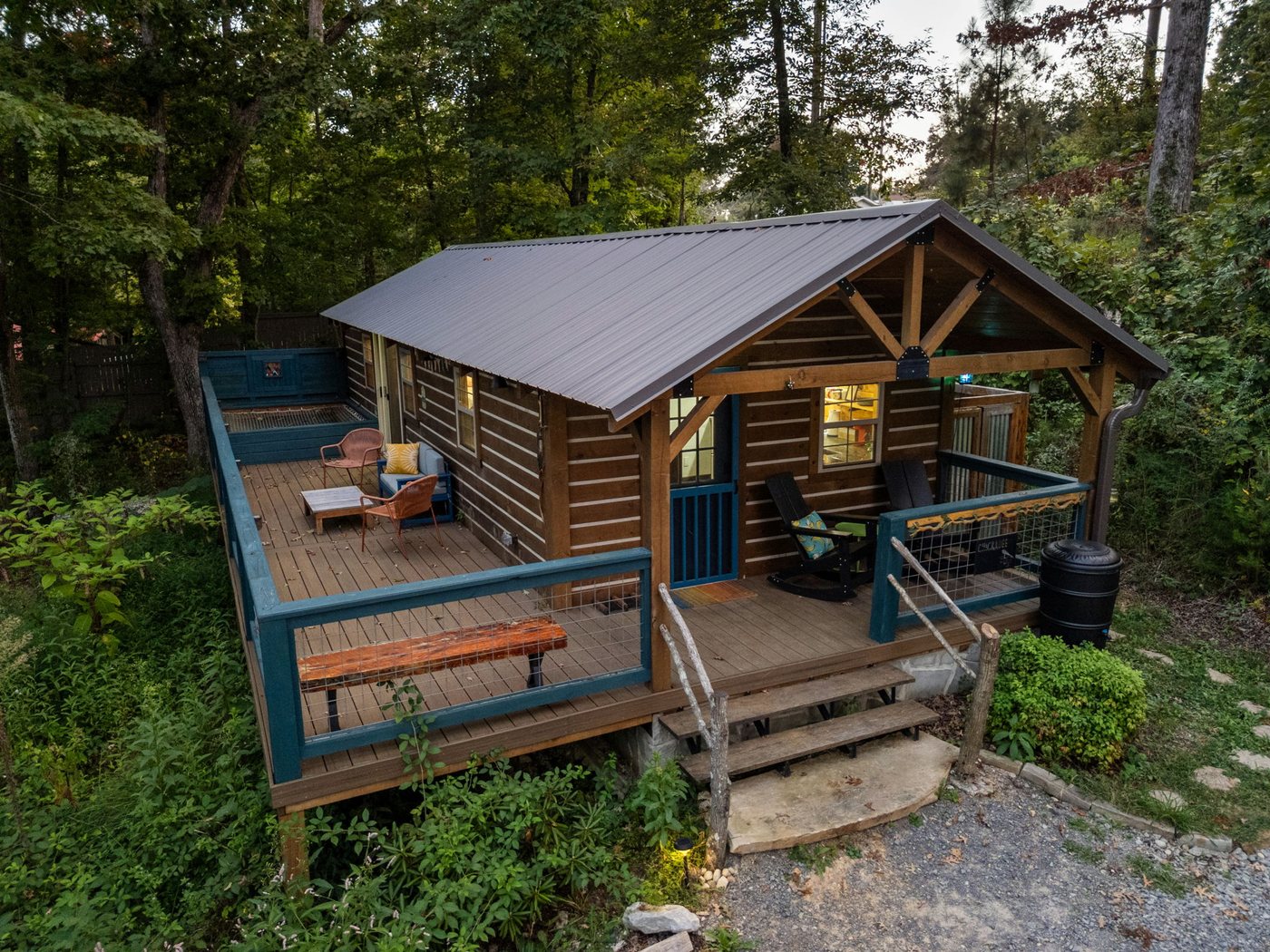 Chickadee cabin and its wraparound deck tucked into the woods