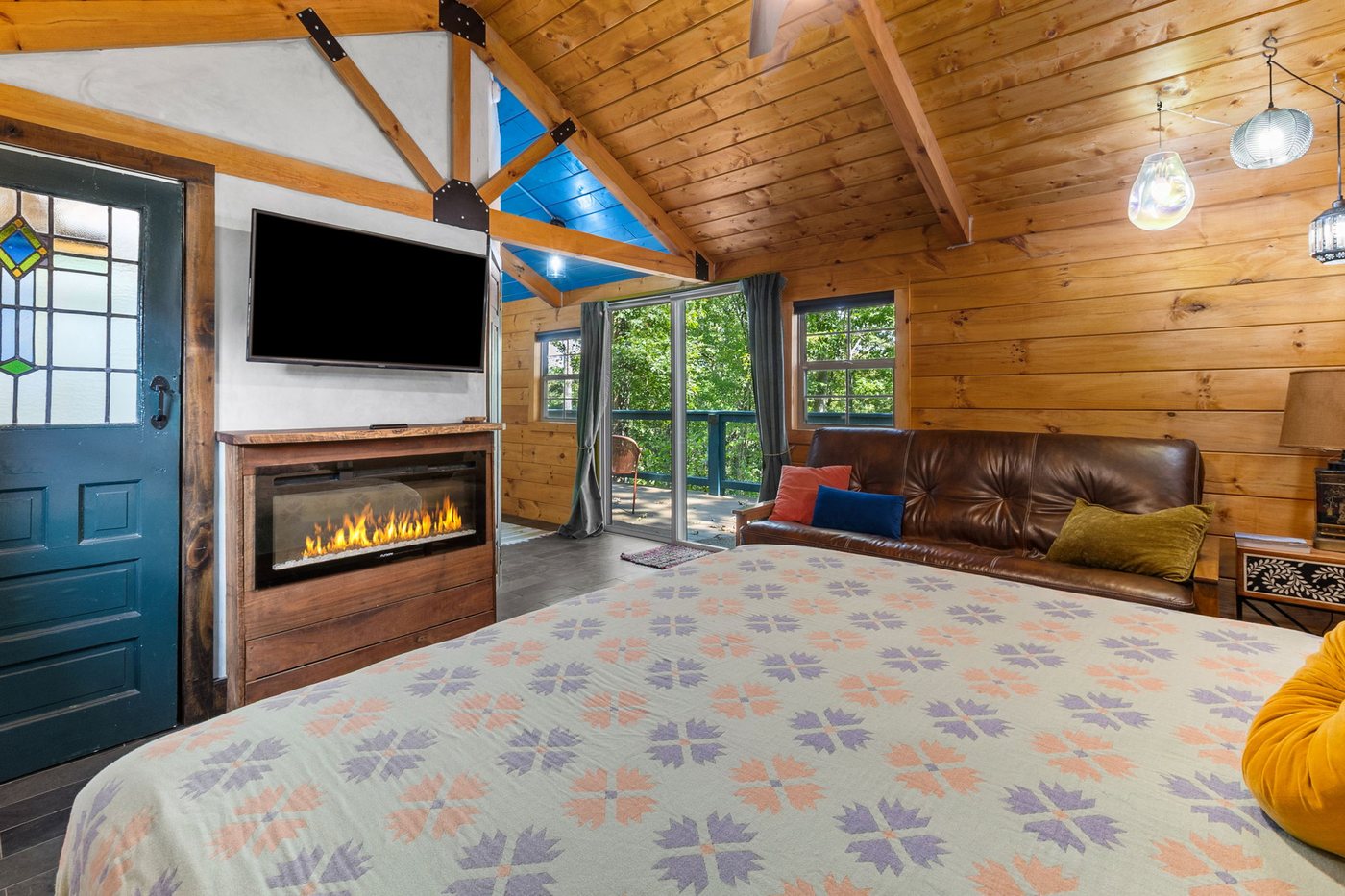 Chickadee electric fireplace and smart TV beside the bed