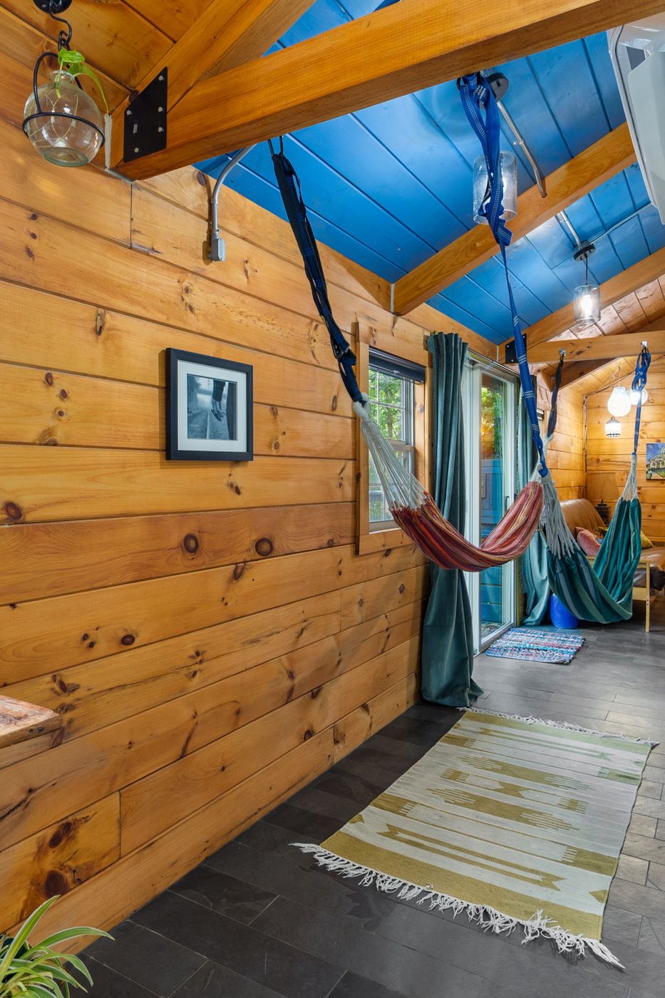 Chickadee in-cabin hammocks beside the sliding door to the deck