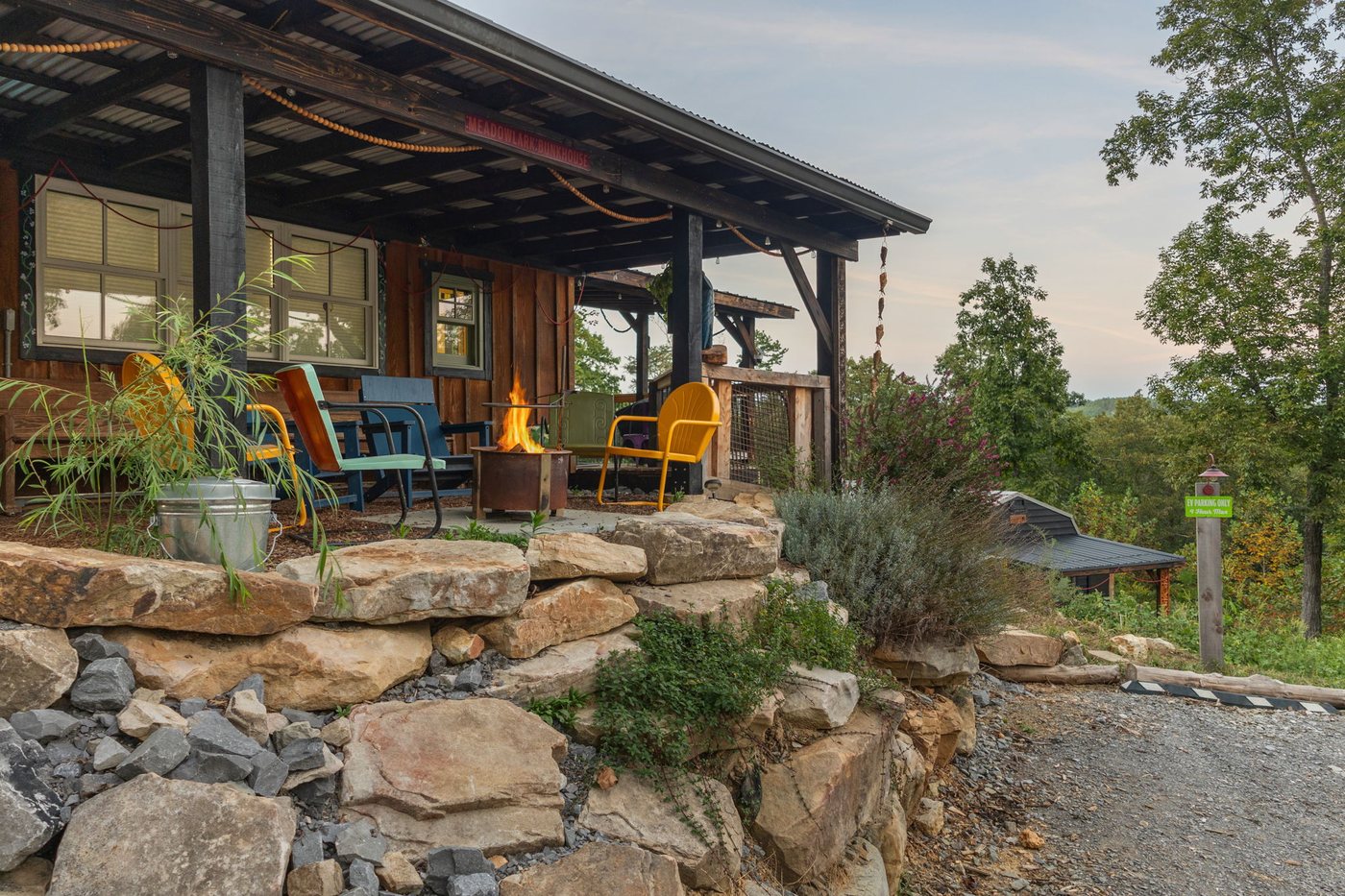 Meadowlark Bunkhouse and its lavender door at dusk