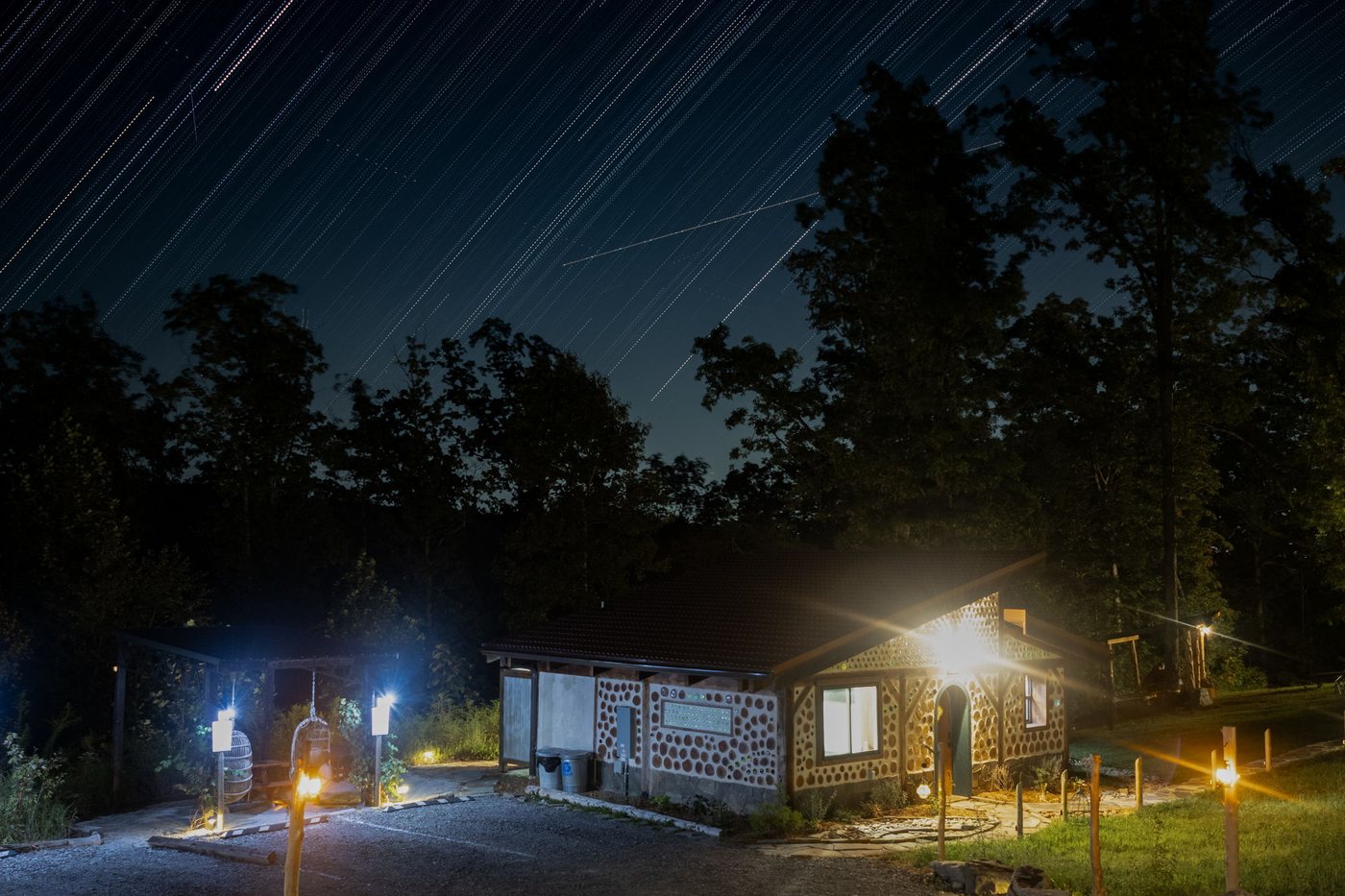 Star trails wheeling over the retreat at night
