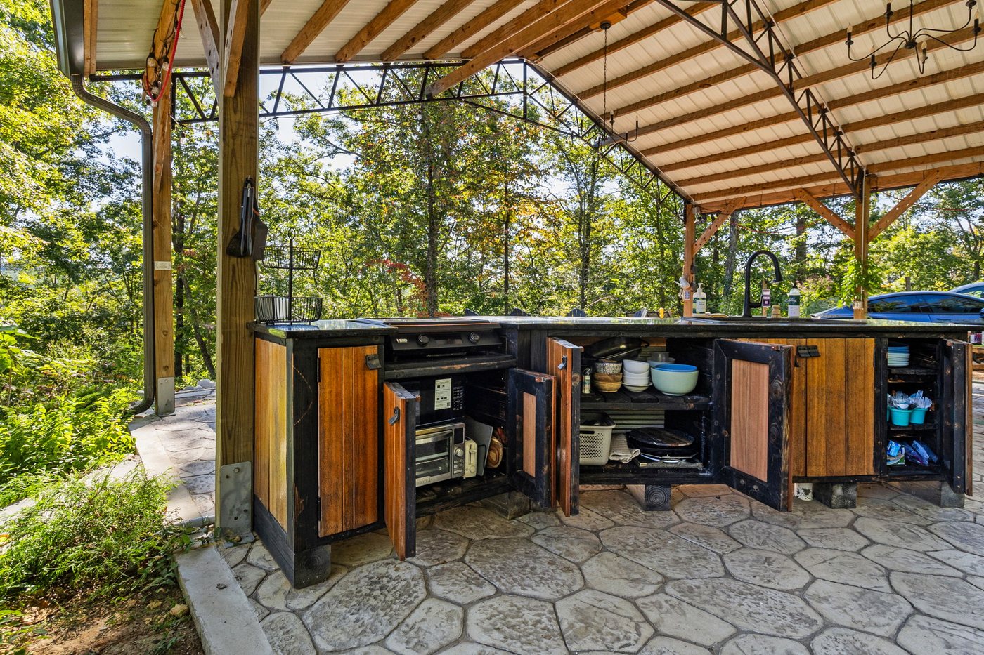 The outdoor kitchen under the pavilion roof