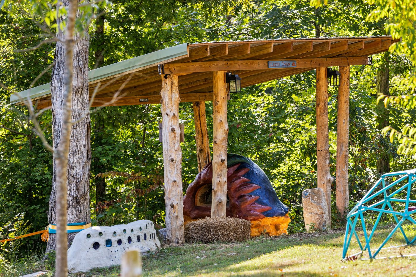 The timber pergola and swing beside the play area