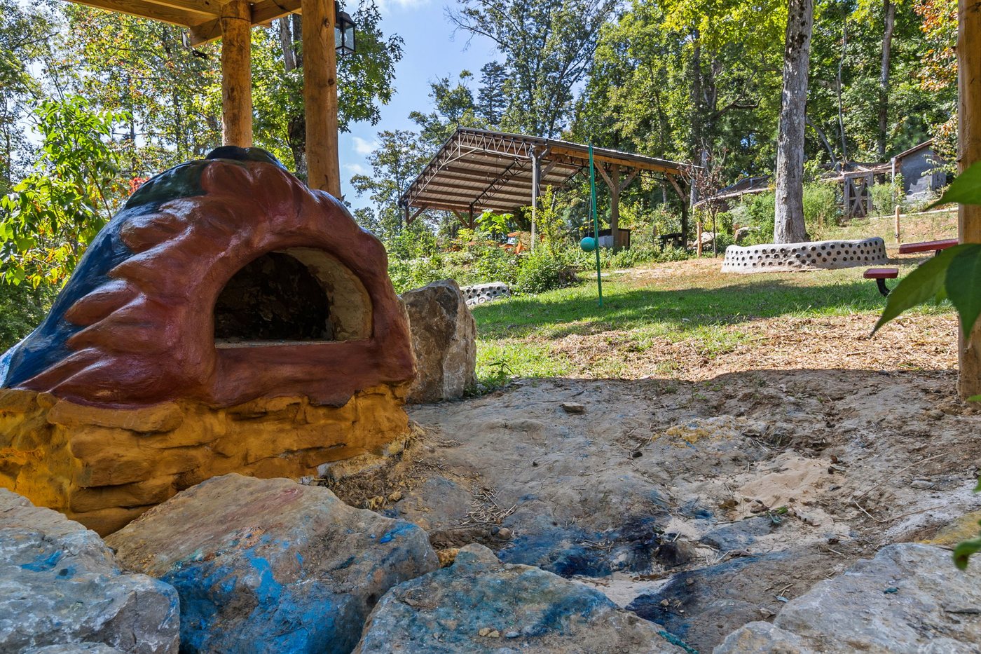 The hand-sculpted cob oven beside the play area