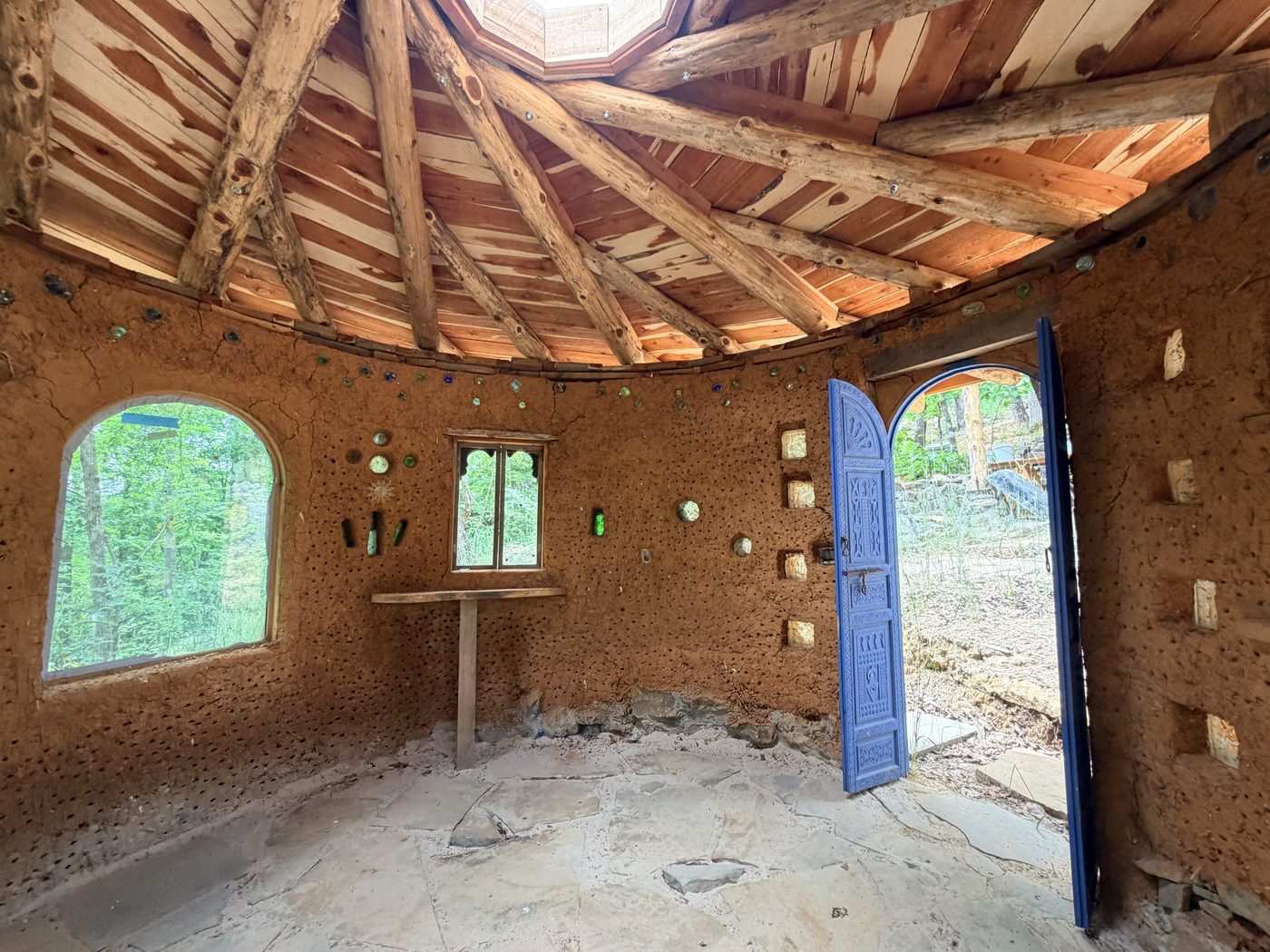 Inside the Ceremony Hut, with its reciprocal roof and arched doors