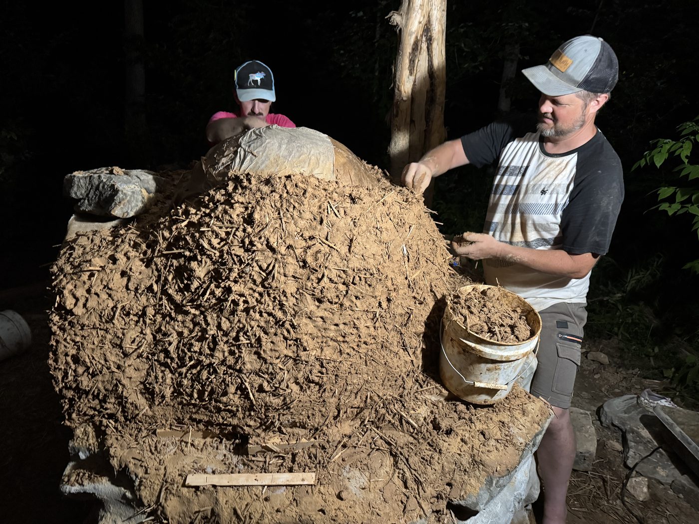 Sculpting the cob oven dome by hand