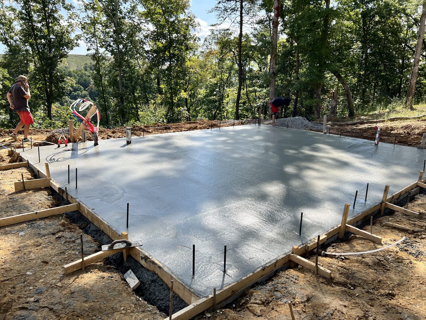 A freshly poured slab waiting on framing