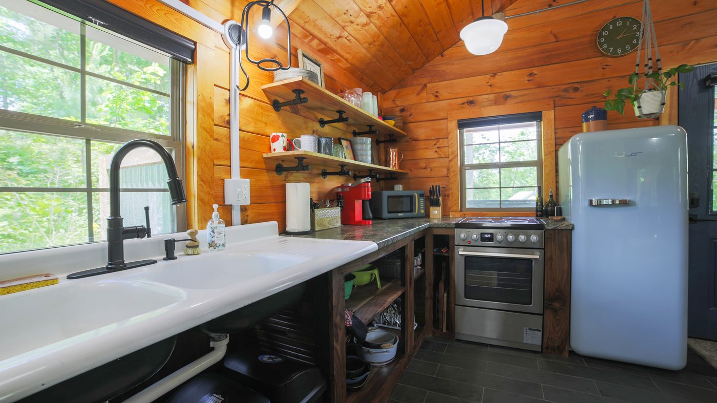 Chickadee kitchen with big windows and open shelving