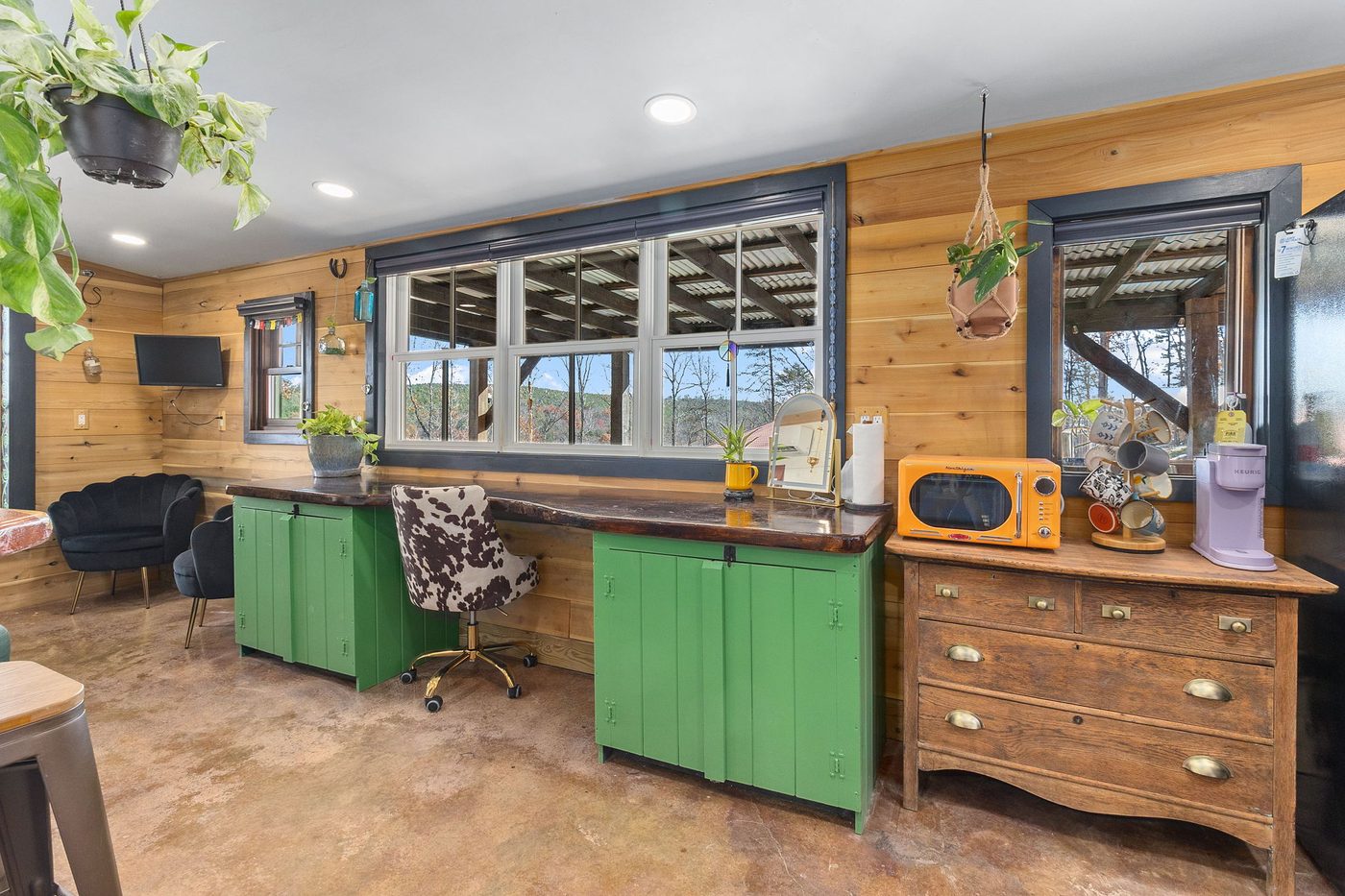 Meadowlark kitchen with green cabinets and big windows