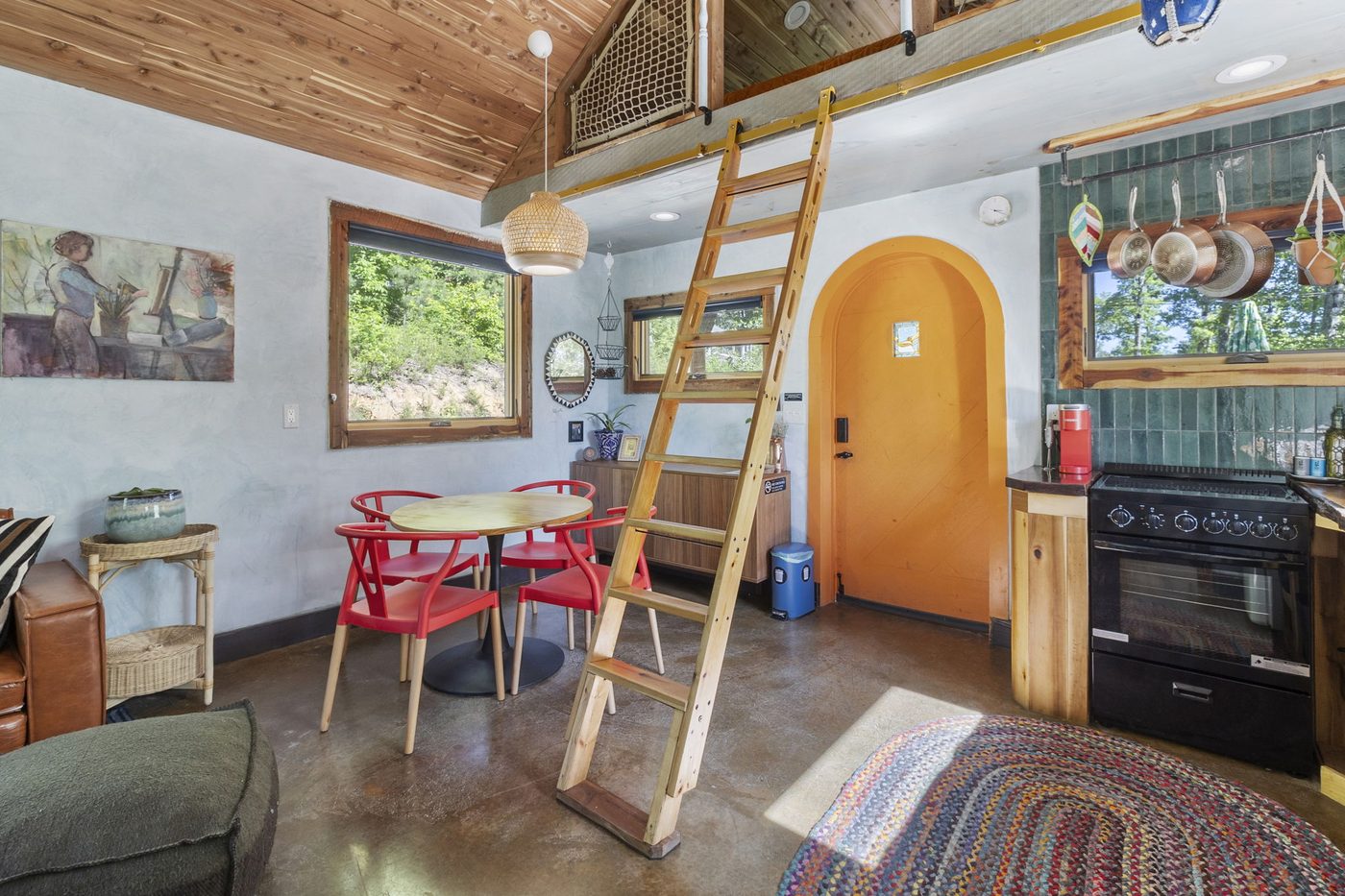 Whippoorwill interior with loft ladder, dining nook and kitchen