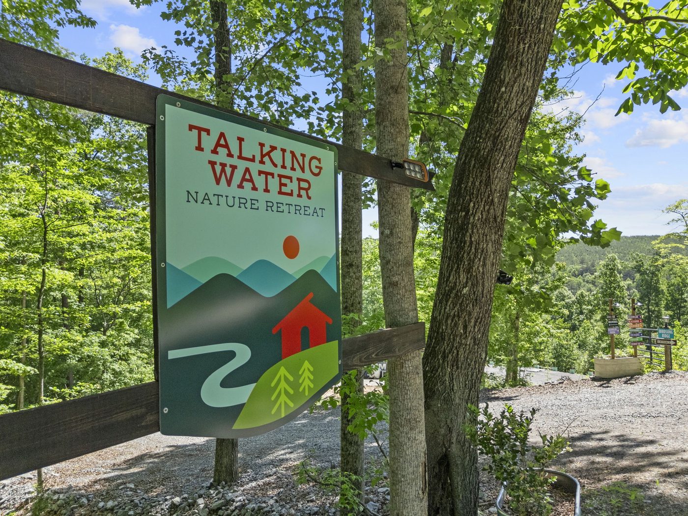 Talking Water Nature Retreat sign in the woods