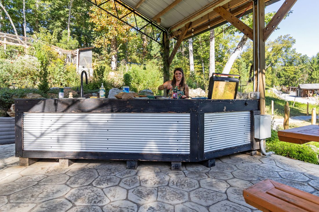 The outdoor kitchen and bar under the pavilion