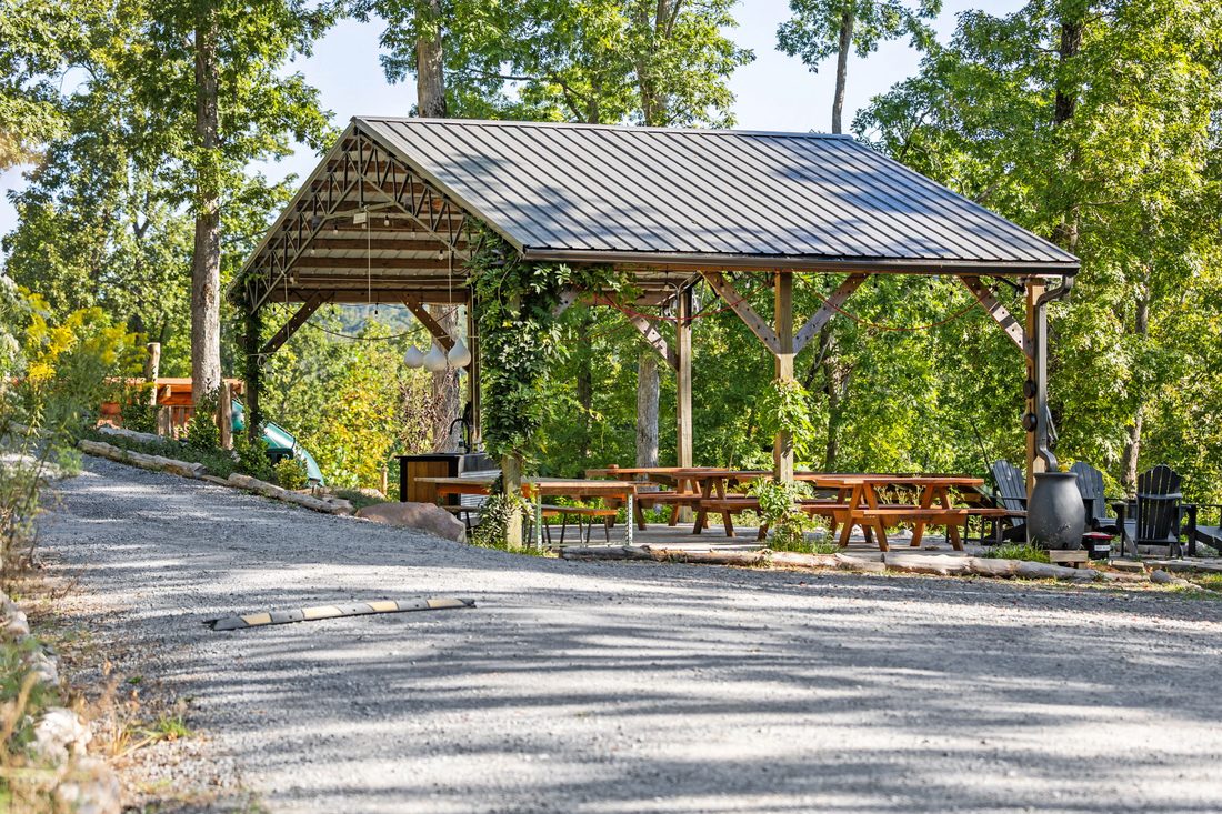 The pavilion and its picnic tables by day