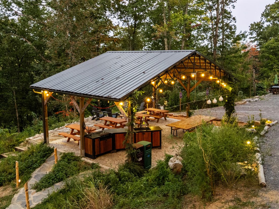 The pavilion at dusk with its lights coming on